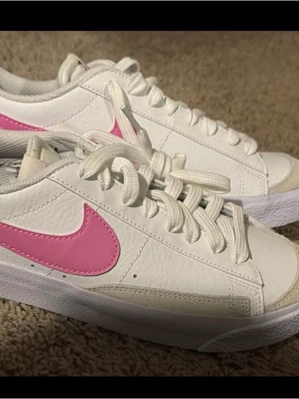 Nike Women’s White Sneakers with Pink Swoosh Accent